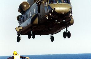 RAF Chinook being marshalled on the deck of HMS Ocean.
