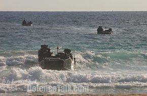 Amphibious Assault Vehicles (AAV) with Marines