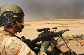 An Aussie Minimi Gunner on an ASLAV vehicle on ops in Iraq