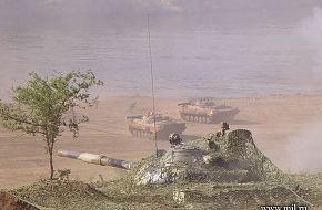 Tank in cover BMP-2s by river