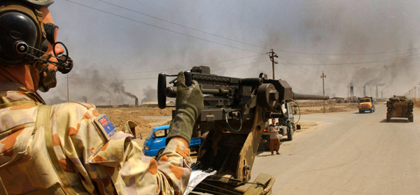A manned 0.50 cal machine gun on an Aussie ASLAV in Iraq