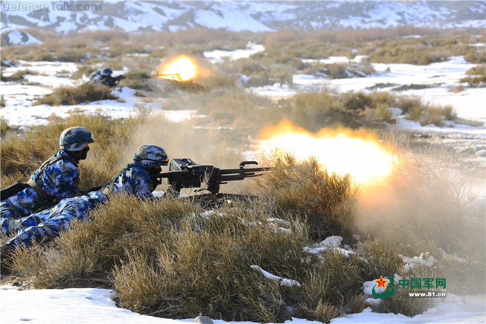 China Marines shoot tripod-mounted heavy machine guns