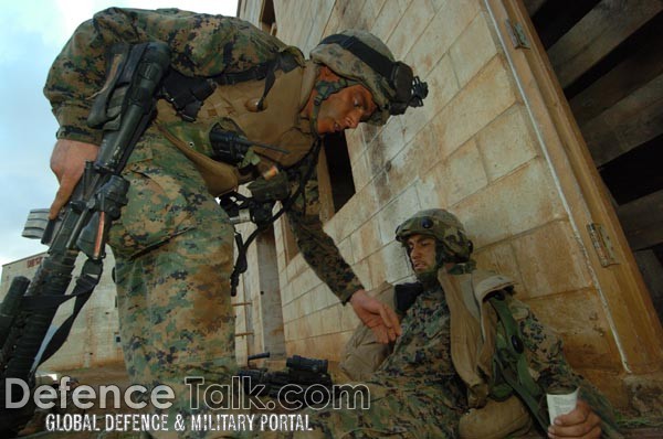 Marines aids a wounded Marine - Military Operation in Urban Terrain (MOUT)