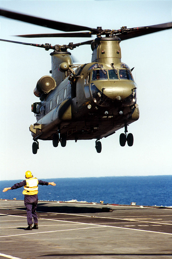 RAF Chinook being marshalled on the deck of HMS Ocean.