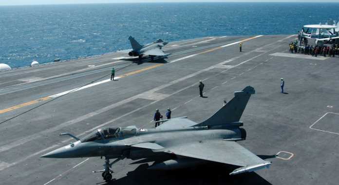 Two French Raphael Jets perform launch and recovery operations from the flight deck of the USS Harry S. Truman (CVN 75)