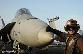 front of an F/A-18C - flight deck of USS Abraham Lincoln