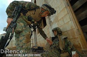 Marines aids a wounded Marine - Military Operation in Urban Terrain (MOUT)