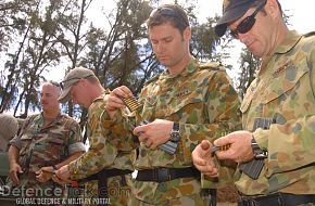 Australian Navy Soldiers load 5.56 ammunition - RIMPAC 2006