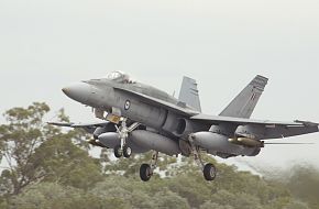 An Aussie F/A-18A loaded up with Mk 82 bombs