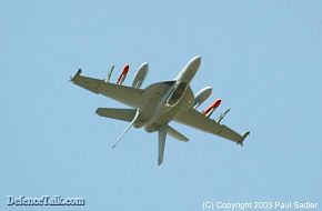 An F/A-18F inverted witha full weapons load, impressive...