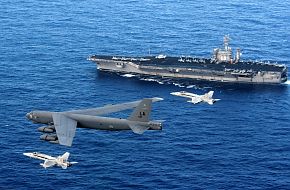 B-52 & F/A-18E fly past USS Nimitz