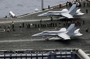 US Navy F/A-18C Hornet launches from USS Kitty Hawk