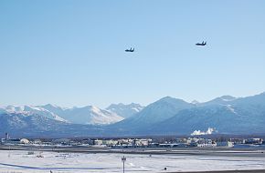 Two F-15E Strike Eagles fly over