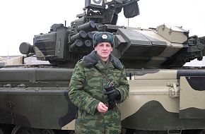 Officer posing with T-90A