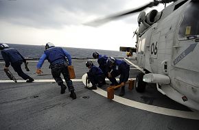 SH-60K helicopter, Sailors remove chocks and chains