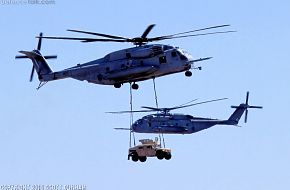 USMC CH-53E Super Stallion Helicopter transporting HMMWV