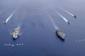 Aircraft from CVW 5 and 17 fly in formation over the Nimitz Carrier Strike Force