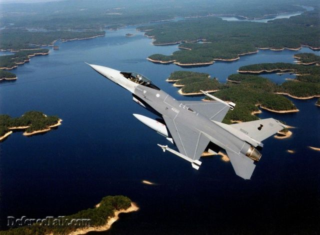 A beautiful shot of a Thai A/F F-16 over a river.