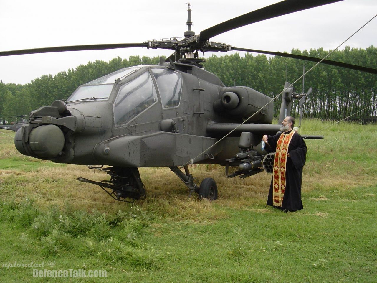 A greek orthodox priest bless an AH-64A+ Apache Hellenic Army