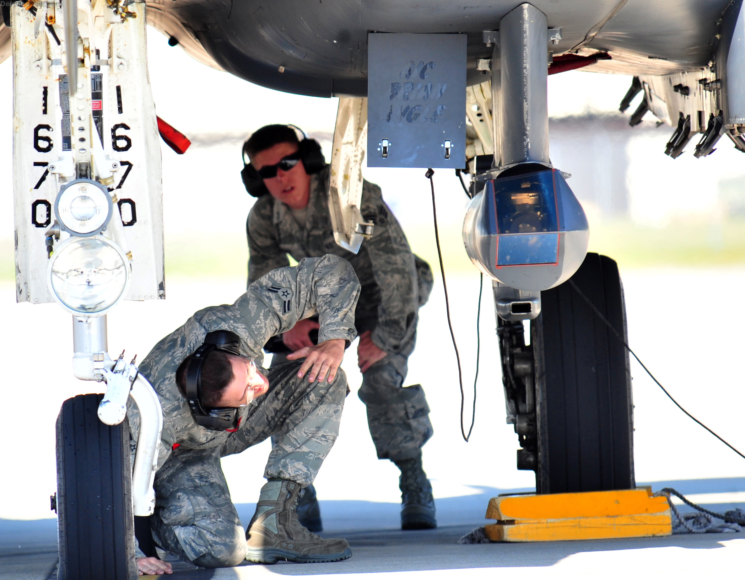 Aircraft Maintenance Unit perform a pre-flight inspection on an F-15E