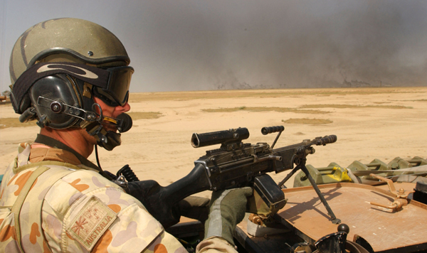An Aussie Minimi Gunner on an ASLAV vehicle on ops in Iraq