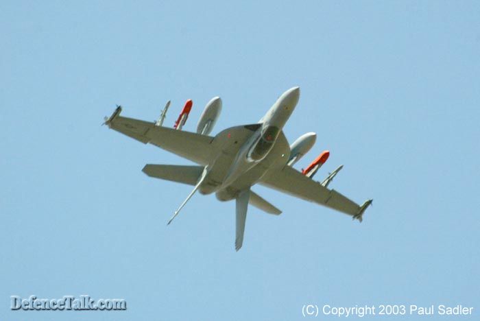 An F/A-18F inverted witha full weapons load, impressive...