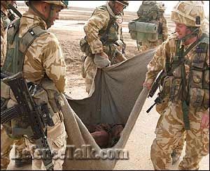 British Troops With Wounded Prisoner