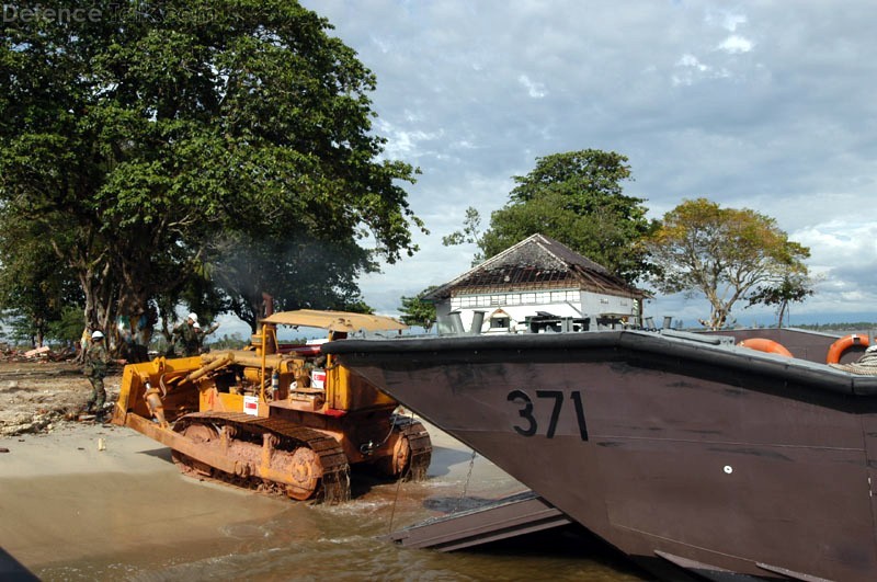 Bulldozer unloading from Fast Craft at Meulaboh