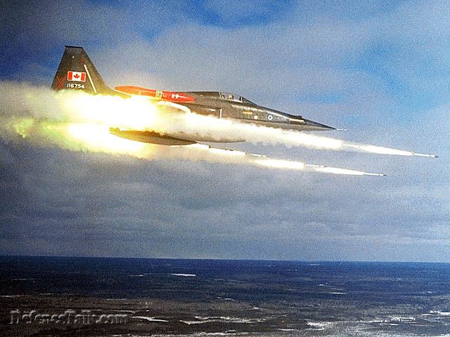 Canadian Air Force F-5 Tiger firing rockets.