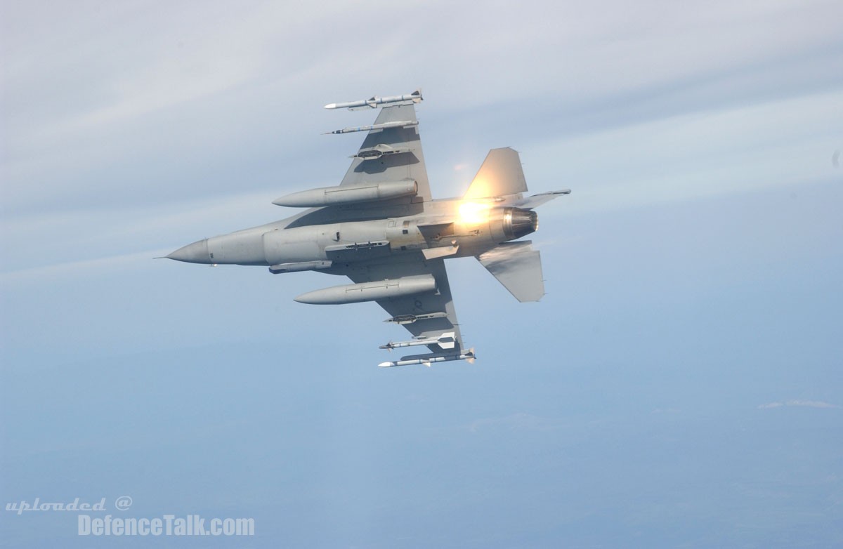 F-16 Fighting Falcon drops flares performing "red air" maneuvers