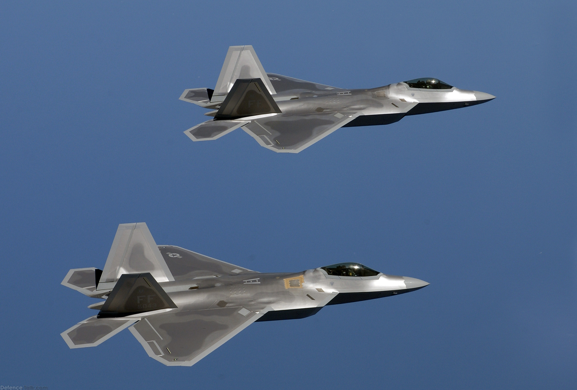 F-22 Raptors fly over Langley Air Force Base, Va., US Air Force