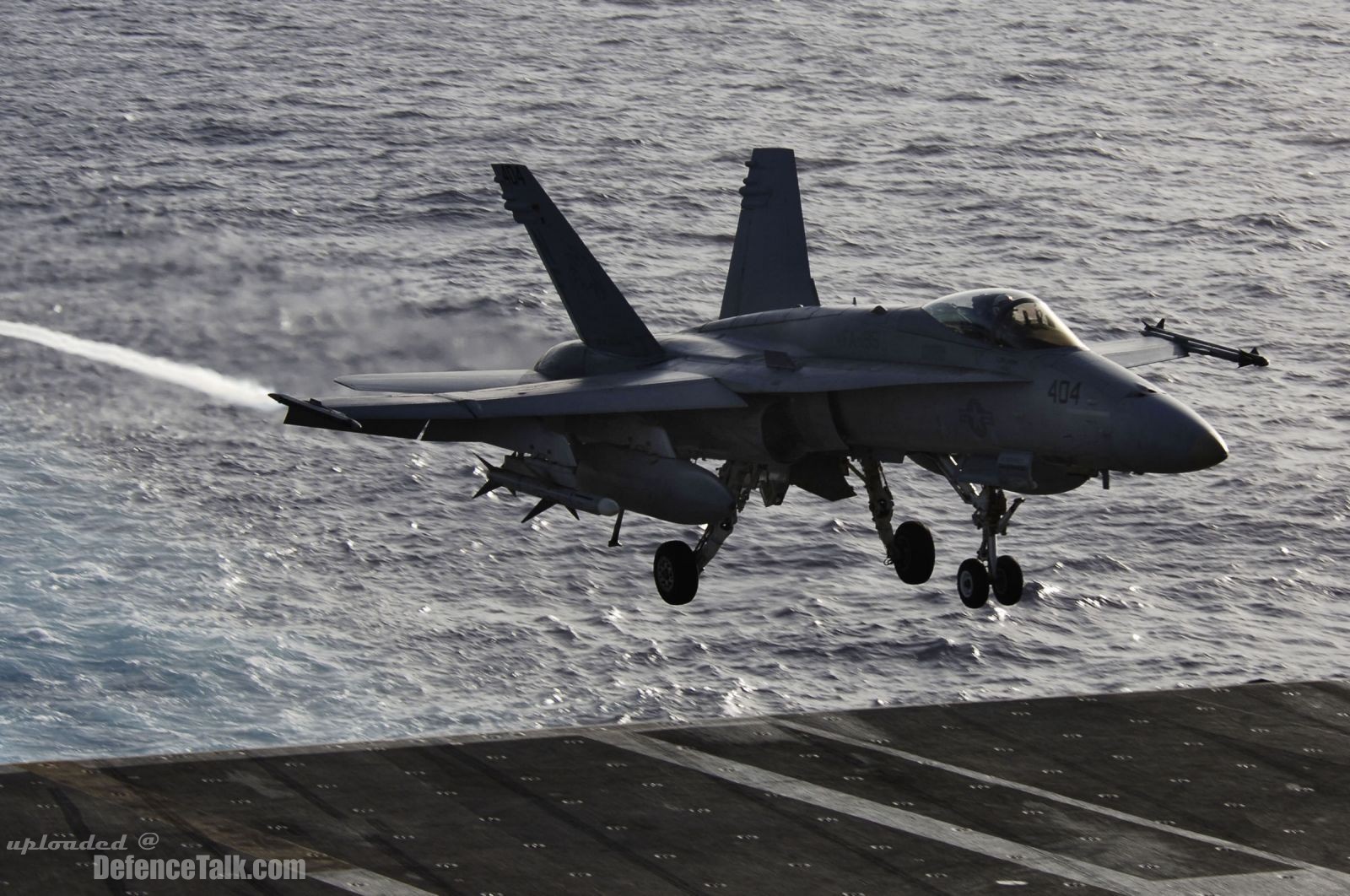 F/A-18C Hornet, prepares to land on the flight deck of USS Kitty Hawk (CV 6