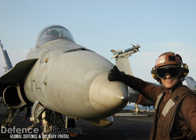 front of an F/A-18C - flight deck of USS Abraham Lincoln
