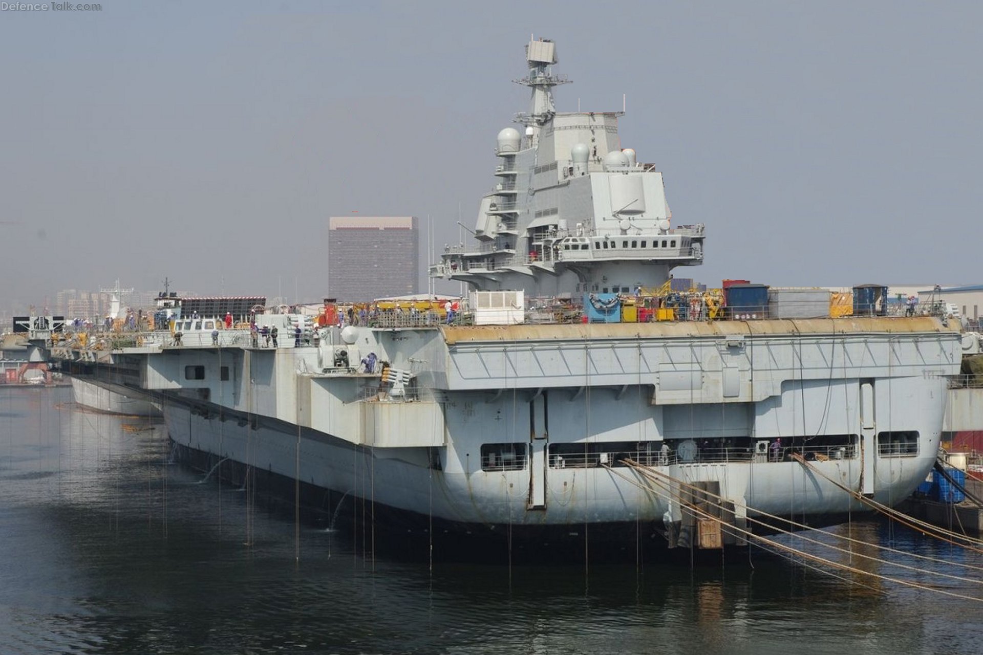 Full view of the new Chinese PLAN aircraft carrier from the port quarter