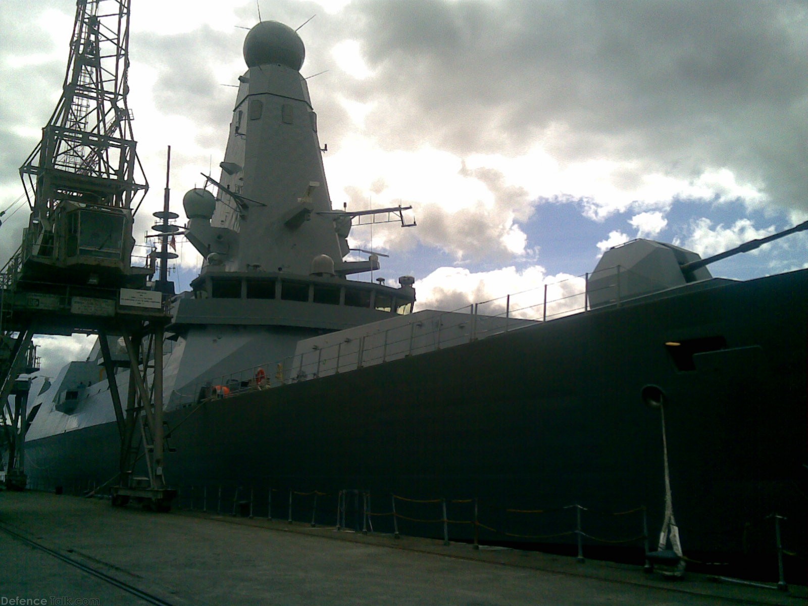 HMS Daring alongside...