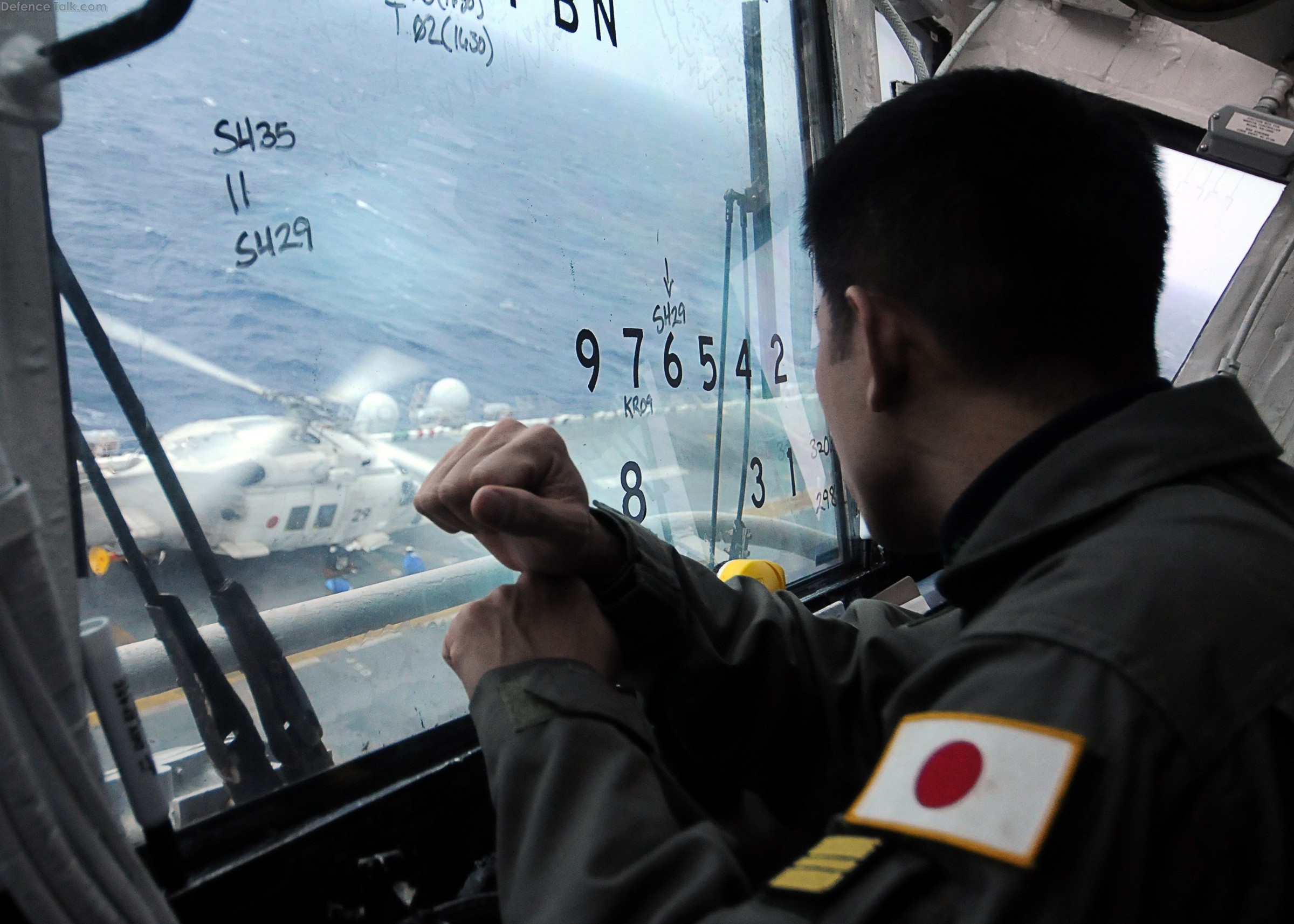 JMSDF SH-60K Sea Hawk helicopter lands