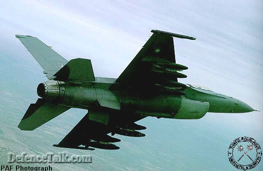Pakistan F-16 carrying 4 TER's with 3 MK.82 GP bombs each banking left. (PA
