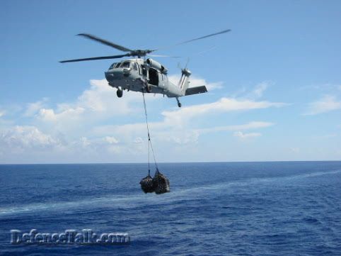 RAN Seahawk dumping a package