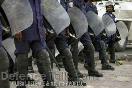 Riot police stand guard - News Pictures