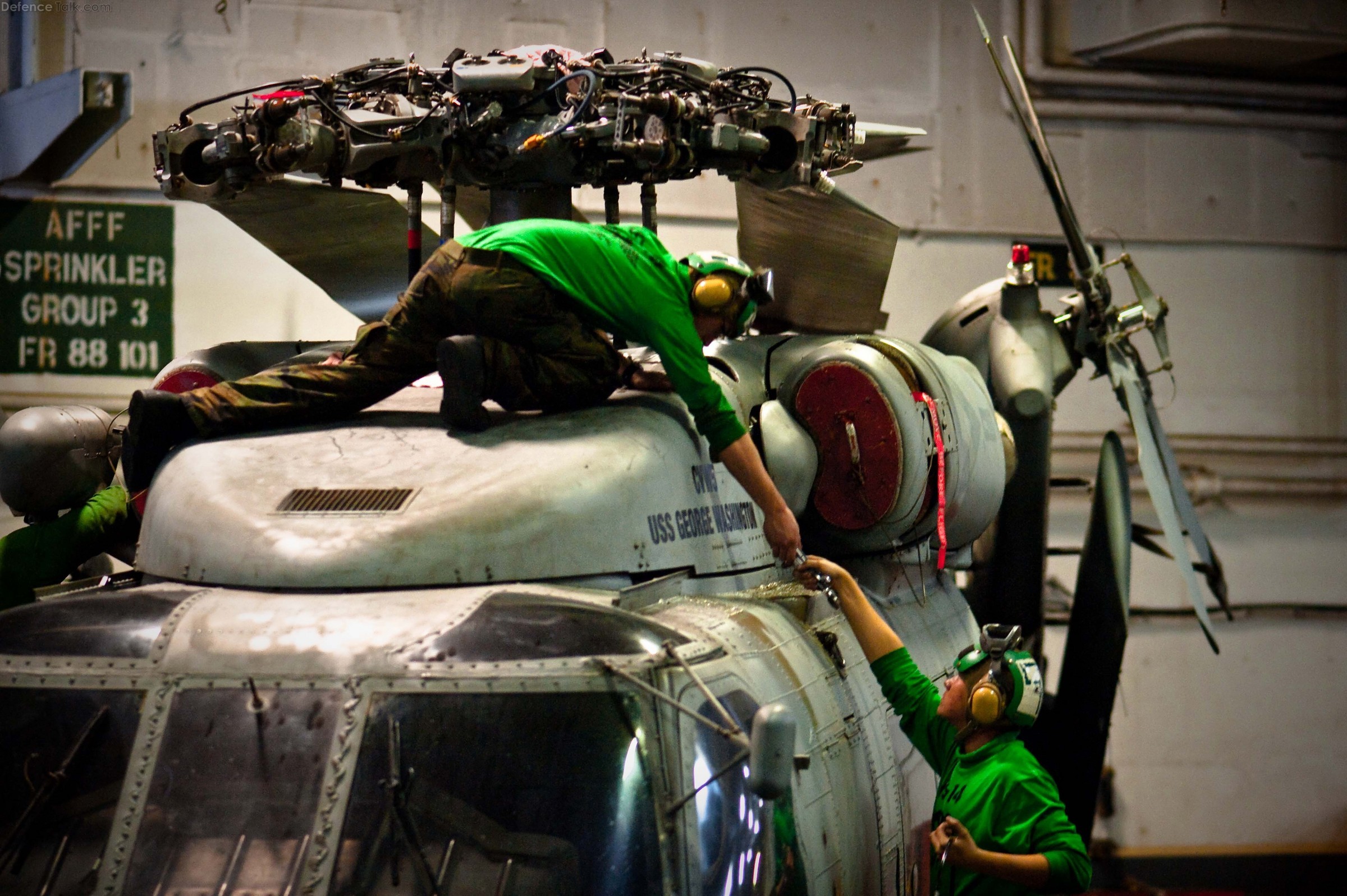 SH-60 helicopter - Aviation mechanics perform maintenance