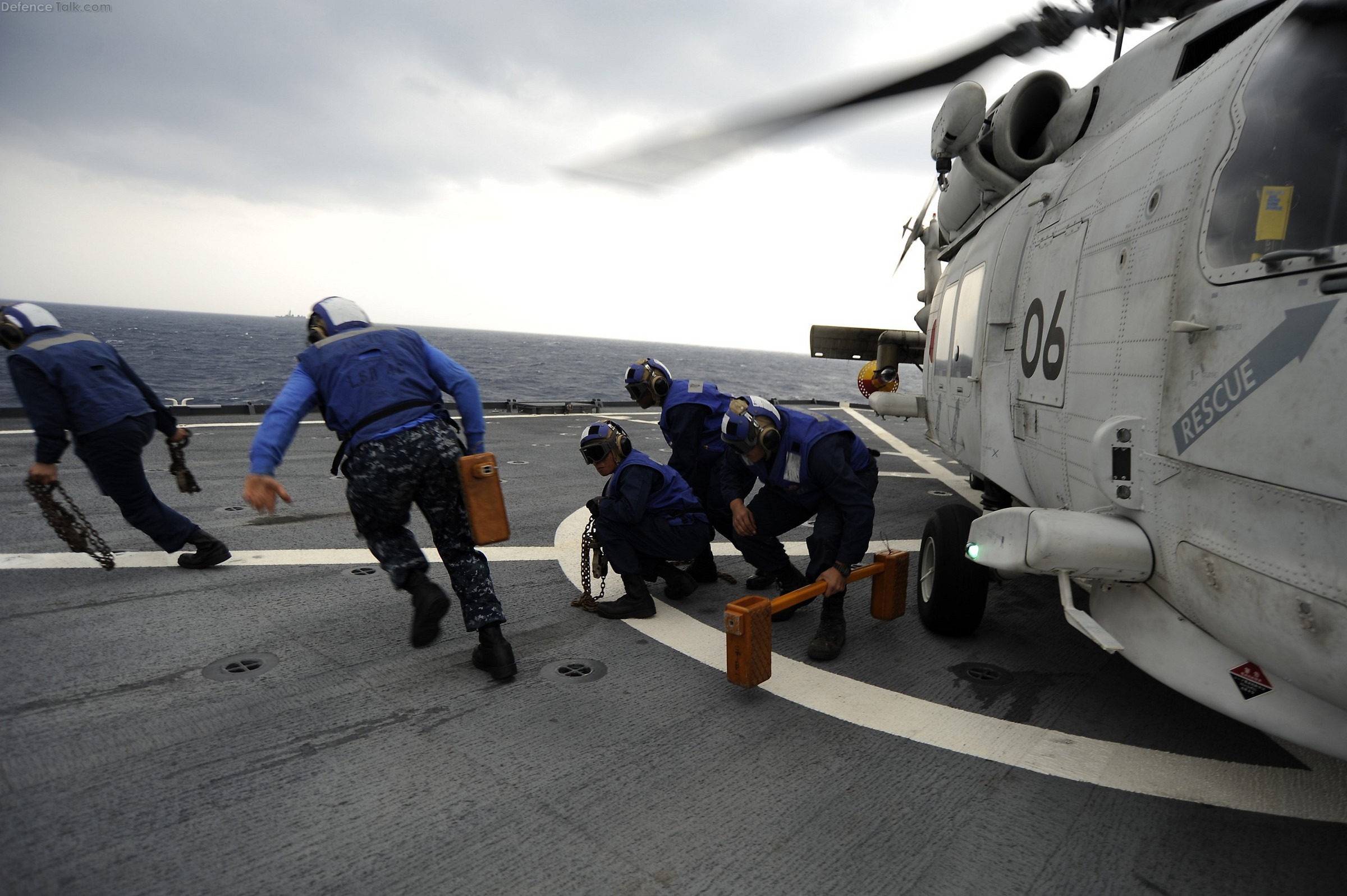 SH-60K helicopter, Sailors remove chocks and chains