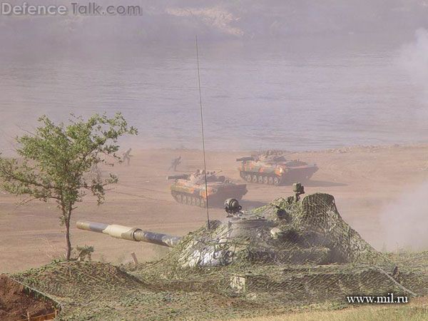Tank in cover BMP-2s by river