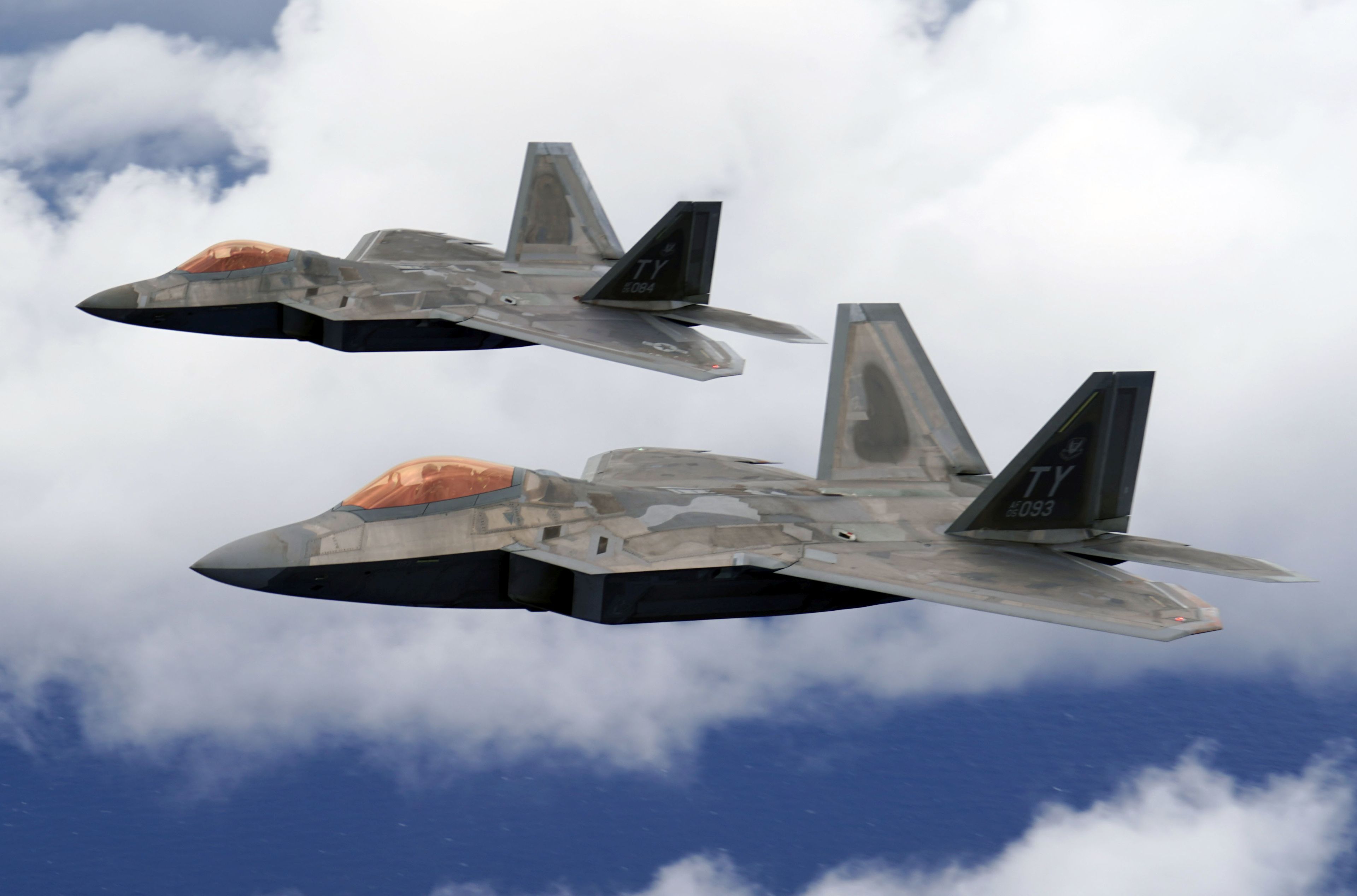 Two F-22 Raptors fly over Joint Base Pearl Harbor-Hickam, Hawaii