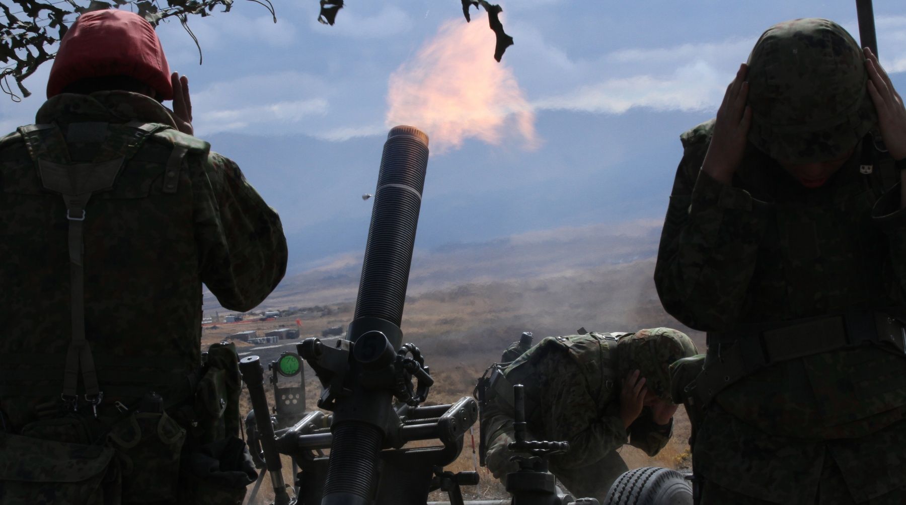 firing a 120-millimeter mortar