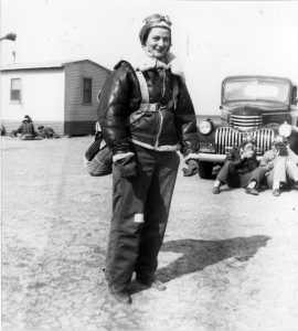 Bernice "Bee" Haydu, a Women's Airforce Service Pilot, or WASP, during World War II, prepares to fly a Stearman Kaydet during flight training at an auxiliary field near Avenger Field in Sweetwater, Texas, in 1944. Because the plane was an open cockpit bi-plane, during the winter months, the pilots wore winter gear such as a fleece-lines helmet and pants. They would make flight notes on the adhesive tape on the pants. (Courtesy photo)