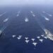 China says holds first dual aircraft carrier drills in South China Sea